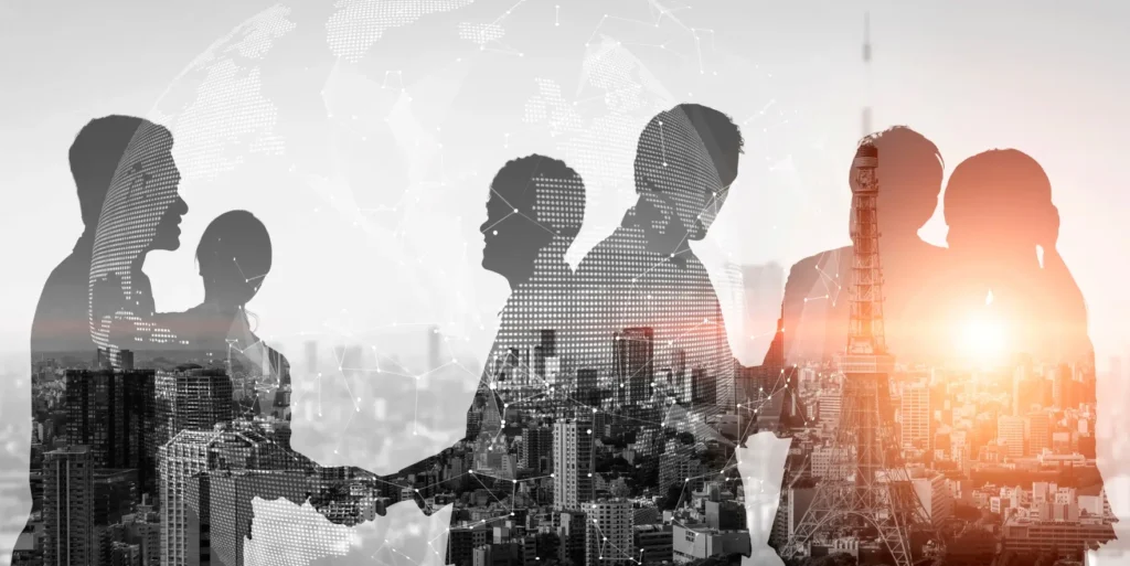 people in a business setting in black and white connecting with the world superimposed