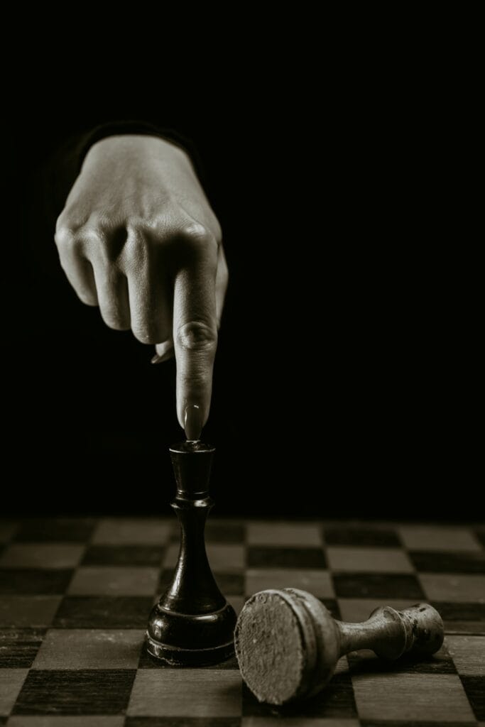 dramatic-chess-board-featuring-hand-and-fallen-pie-2026-Seal Media Creative Video Production Agency